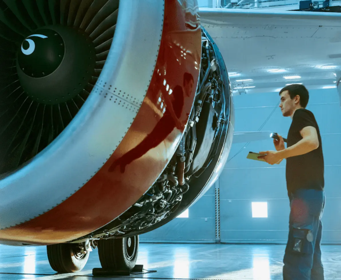 man working on a plane
